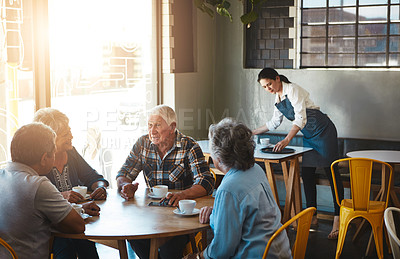 Buy stock photo Shot of senior couples on a double date at a cafe