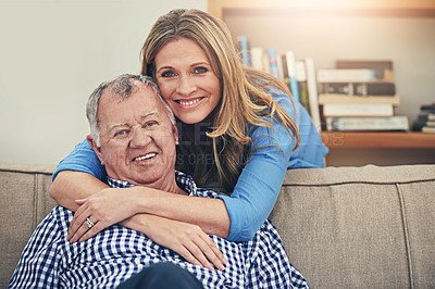 Buy stock photo Portrait of a happy mature woman hugging her elderly father at home