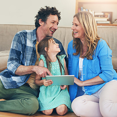 Buy stock photo Happy, tablet and parents with child on floor for watching movies, cartoons and online entertainment. Family, home and dad, mom and girl on digital tech for internet, videos and relax on weekend