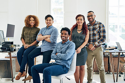 Buy stock photo Portrait of a team of happy and confident colleagues working in a modern office