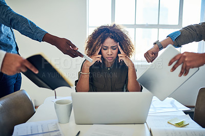 Buy stock photo Shot of a stressed out young woman working in a demanding career