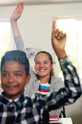 Buy stock photo Question, happy and hands of children in classroom for answer in lesson, learning and education. Child development, school and young girl student with hand raised for asking, feedback and knowledge