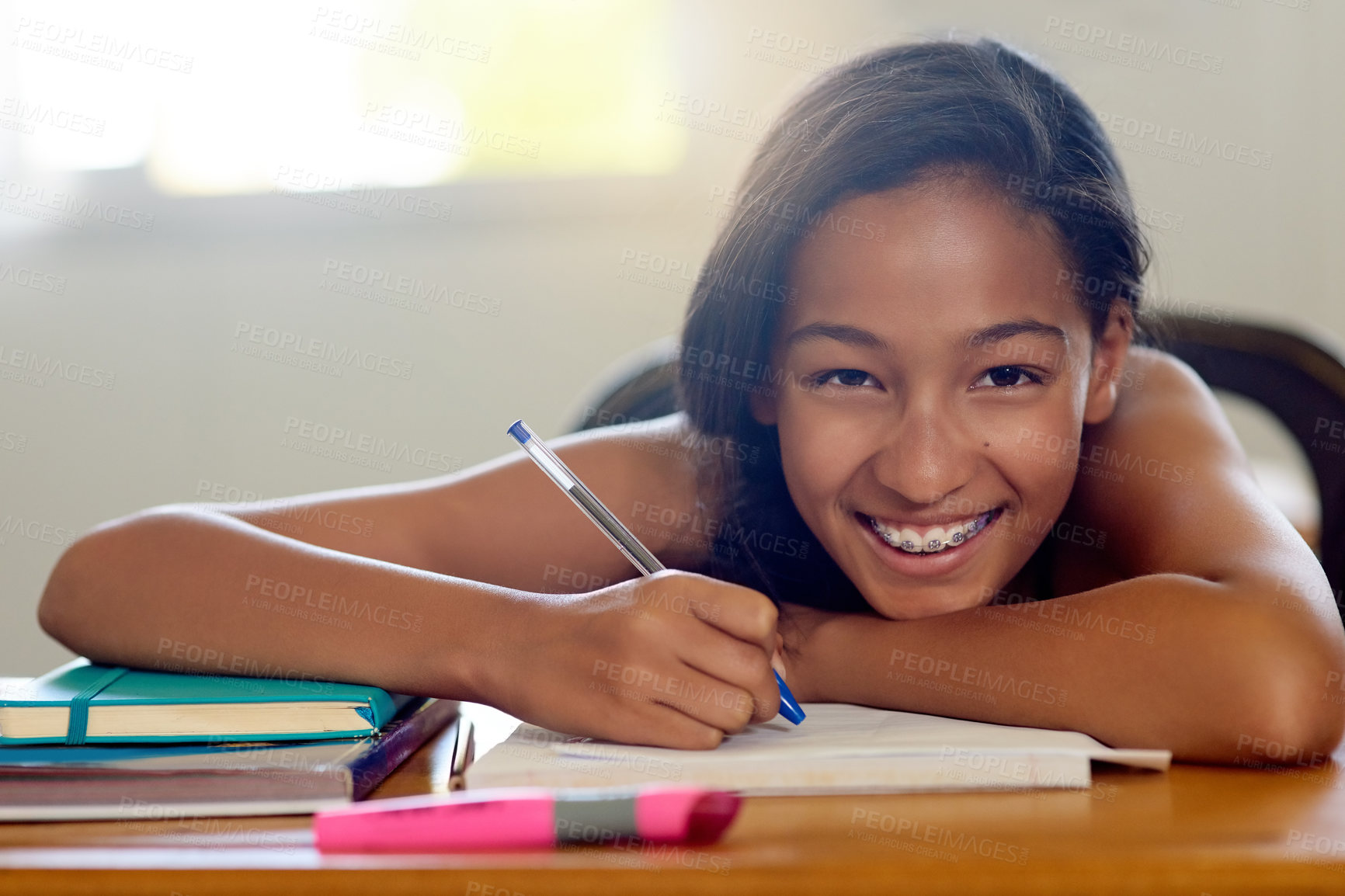 Buy stock photo Portrait, girl and happy with notebook in classroom at school for education, knowledge and lesson for child development. Female person, smile and satisfied as kid on writing for teaching or learning