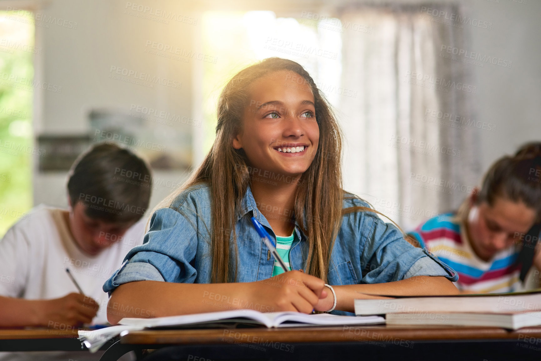 Buy stock photo Student, girl and smile with notebook in classroom at school for education, knowledge and lesson for child development. Teenager, happy and satisfied as kid with writing for exam, test and assessment