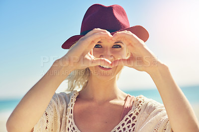 Buy stock photo Woman, hands and heart with portrait on beach for visual representation of expression for love, happiness and gratitude. Girl, romantic gesture or symbol and sign of affection, outdoor and support.