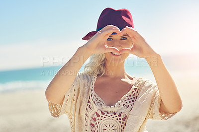 Buy stock photo Girl, hands and heart with portrait on beach for visual representation of expression for love, happiness and gratitude. Woman, romantic gesture or symbol and sign of affection, outdoor and support.