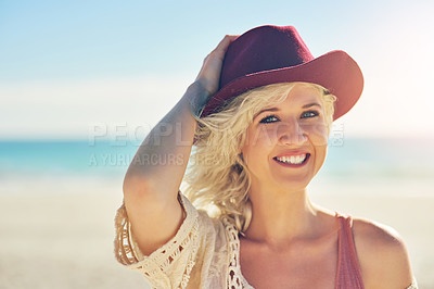 Buy stock photo Portrait, relax and woman on beach with hat, smile and sunshine on summer holiday in California. Nature, sun and happy girl at ocean with vacation, adventure and travel with wind, blue sky and sea.