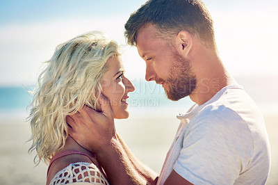 Buy stock photo Smile, couple and holiday on beach with love for seaside romance, serene seascape and ocean view with affection. Man, woman and together for bonding by coast on weekend date, embrace and hug