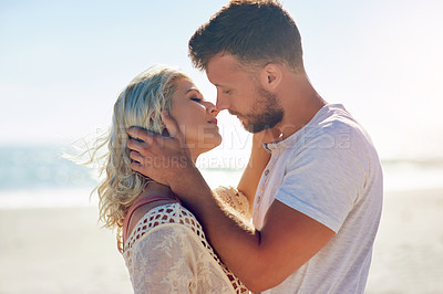 Buy stock photo Cropped shot of n affectionate couple spending the day at the beach