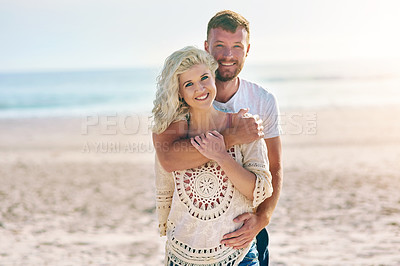 Buy stock photo Portrait, couple and hug on beach with love for seaside romance, serene seascape and ocean view with affection. Man, woman and hug for bonding by coast on weekend date, embrace and mockup with care.