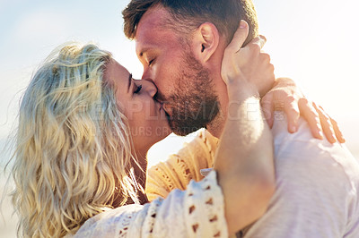 Buy stock photo Happy, couple and kiss on outdoor with love for vacation romance, summer holiday and trip with affection. Man, woman and hug for bonding by beach on weekend date, embrace and support with care.