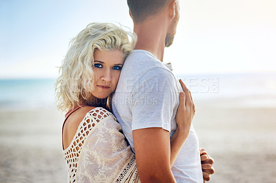 Buy stock photo Cropped shot of n affectionate couple spending the day at the beach