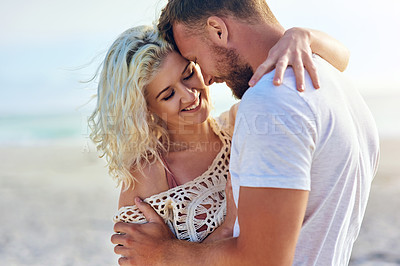 Buy stock photo Happy, couple and hug on beach with love for seaside romance, serene holiday and ocean with affection. Man, woman and together for bonding by coast on weekend date, embrace and break with care.