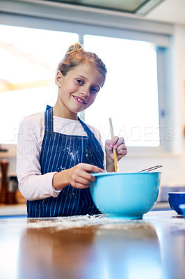 Buy stock photo Portrait of a little girl baking in the kitchen at home