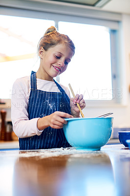 Buy stock photo Smile, kid and girl baking in kitchen for learning recipe for dessert in home. Happy child, cooking and mix dough in bowl for meal, food and pastry preparation with flour to sale cookies at school