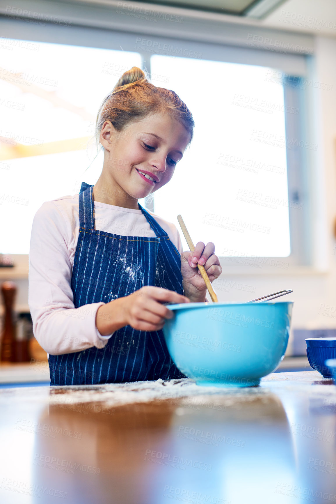 Buy stock photo Smile, kid and girl baking in kitchen for learning recipe for dessert in home. Happy child, cooking and mix dough in bowl for meal, food and pastry preparation with flour to sale cookies at school