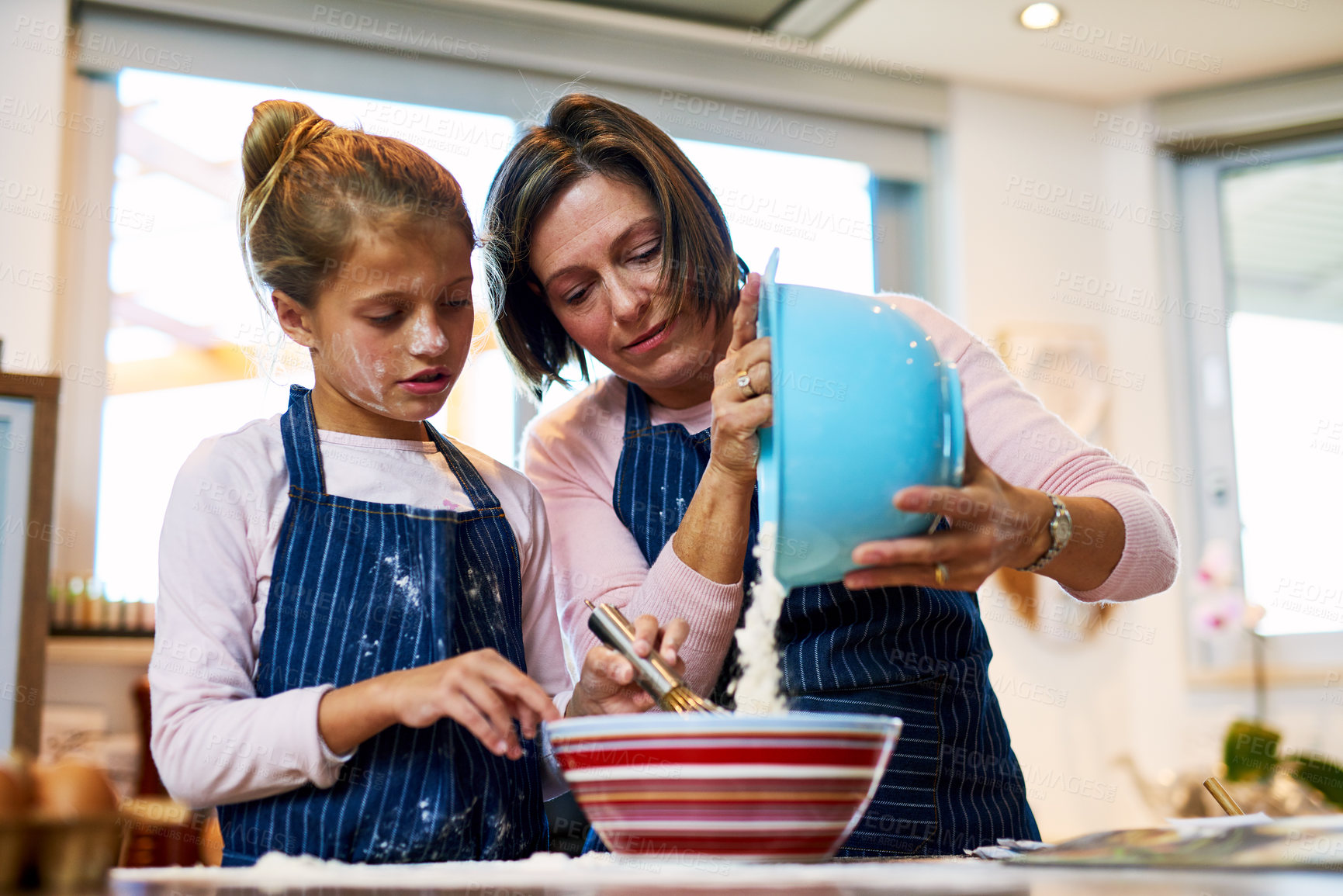 Buy stock photo Mom, kid and girl baking in kitchen for learning to help with recipe for dessert in family home. Child, mother and mix dough in bowl for cooking food or parent teaching pastry preparation with flour