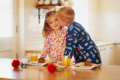 Buy stock photo Cropped shot of a little boy giving his sister a kiss on the cheek at home