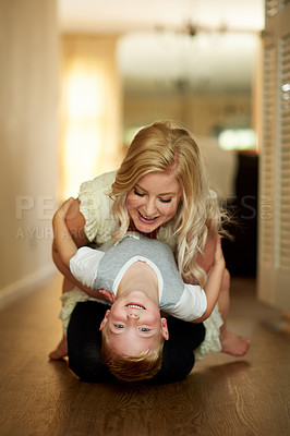 Buy stock photo Shot of a mother bonding with her little son at home