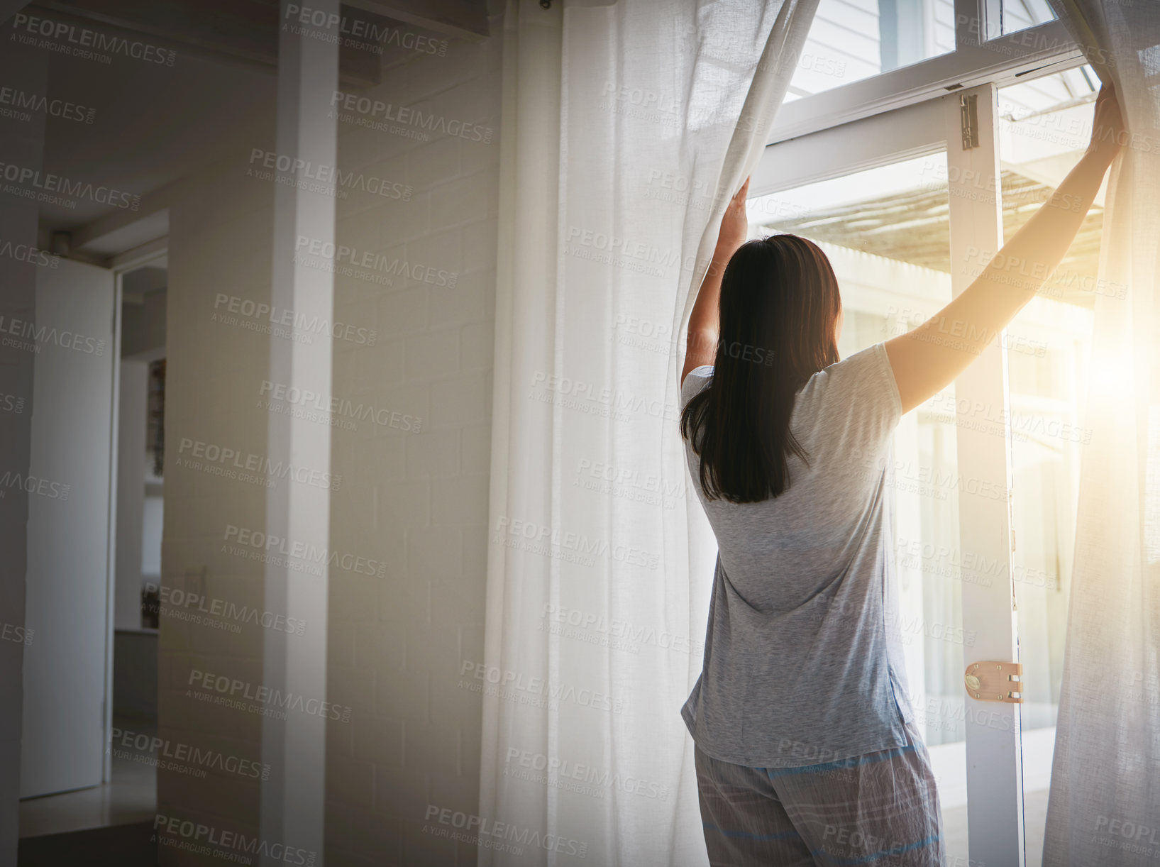 Buy stock photo Back, woman and open curtain in morning, window and fresh wake up with sunrise in hotel ready for day. Routine, outside view and nature on holiday or weekend, drapes and light in apartment in bedroom