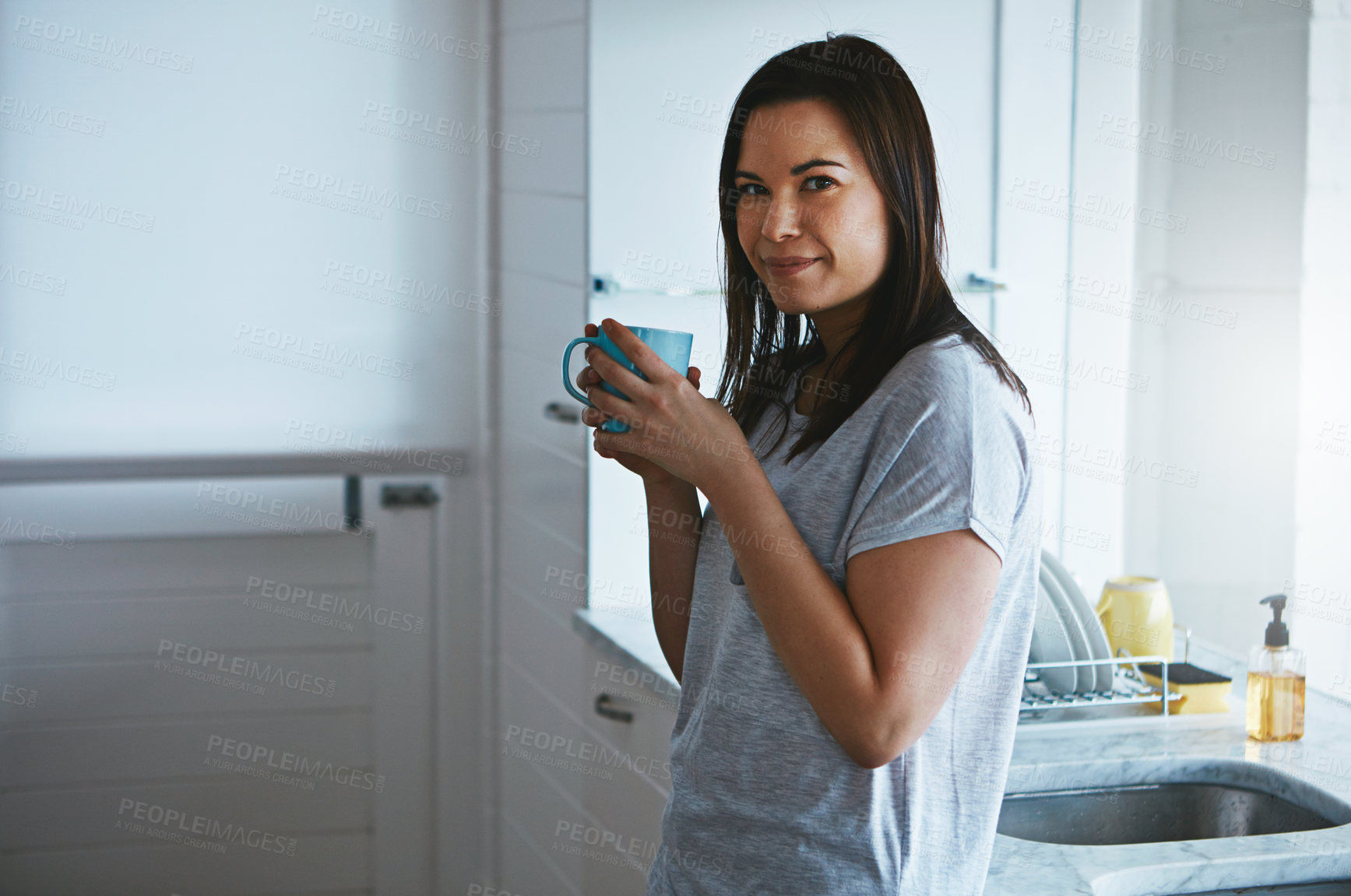 Buy stock photo Portrait, coffee and smile with woman in kitchen in home for morning, calm and wellness drink. Relax, wake up beverage and drinking tea with female person and mug in house for weekend break and peace