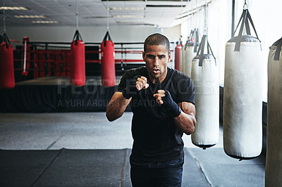 Buy stock photo Fitness, punching and portrait of man in gym for exercise, boxing challenge or competition training. Power, muscle and champion boxer at workout with confidence, fight and energy in MMA sports club.