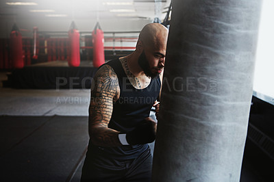 Buy stock photo Fitness, punching bag and man in boxing ring for workout, challenge or competition training. Power, muscle and strong champion boxer in exercise with confidence, fight and energy in MMA sports club.