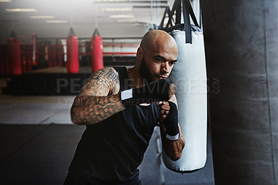 Buy stock photo Fitness, punching bag and man in boxing for workout, gym challenge or competition training. Power, muscle and strong champion boxer in exercise with confidence, fight and energy in MMA sports club.