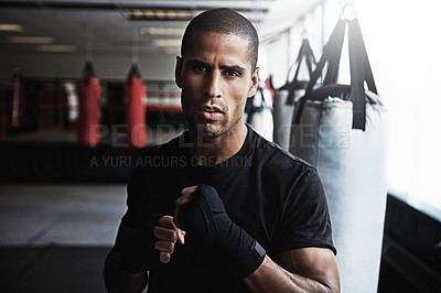 Buy stock photo Portrait, punching and man in boxing gym for workout, challenge or competition training. Power, muscle and strong champion boxer in exercise with confidence, fitness and energy in MMA sports club.