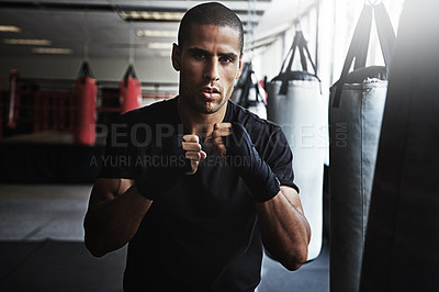 Buy stock photo Portrait, punching bag and man in boxing gym for workout, challenge or competition training. Power, muscle and strong champion boxer in exercise with confidence, fitness and energy in MMA sports club