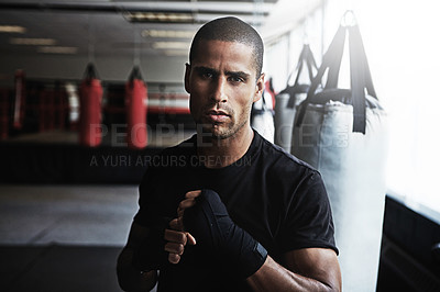 Buy stock photo Portrait, punching and man in gym for boxing workout, challenge or competition training. Power, muscle and strong champion boxer in exercise with confidence, fitness and energy in MMA sports club.