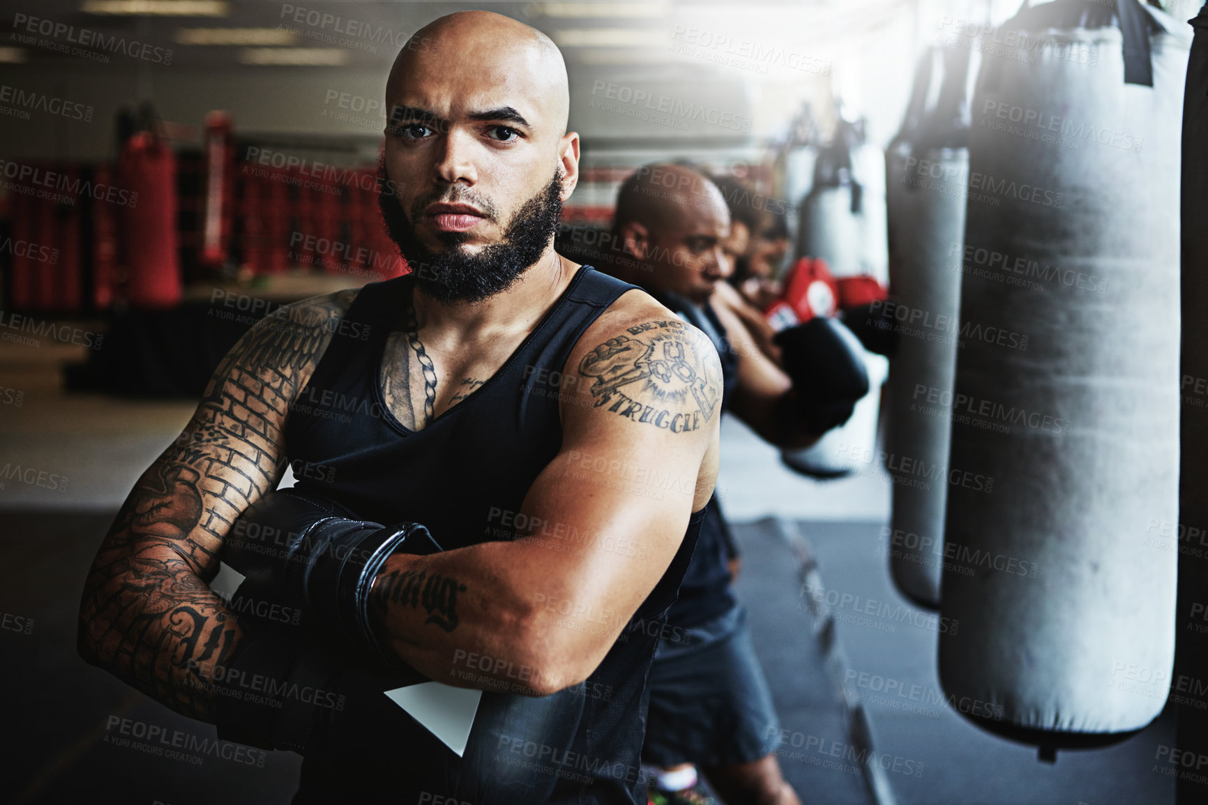 Buy stock photo Shot of a male boxer training at the gym