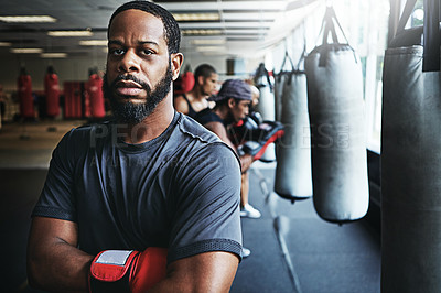 Buy stock photo Shot of a male boxer training at the gym