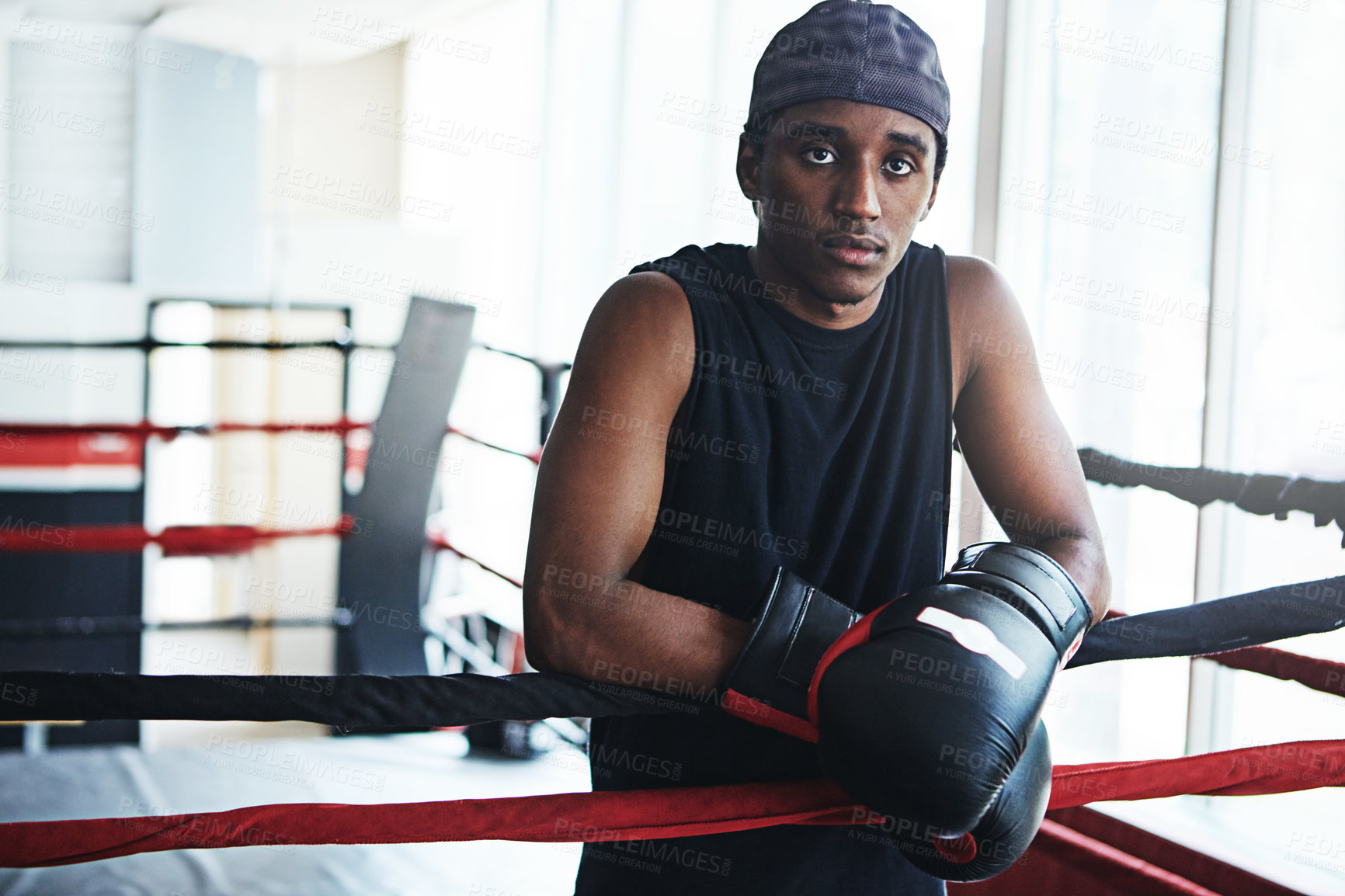 Buy stock photo Black man, boxer and portrait for training, exercise or fitness workout ready for fight at gym. African fighter, boxing and competitive sports for ring match, health and wellness with endurance