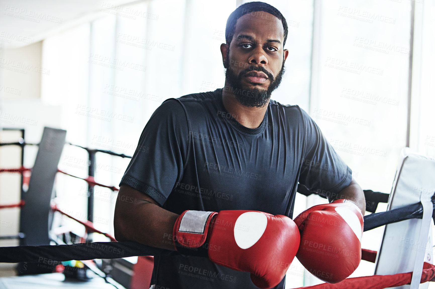 Buy stock photo Black man, boxer and portrait for training, wellness or fitness workout ready for fight at gym. African fighter, boxing and competitive sports for ring match, health and exercise with endurance