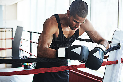 Buy stock photo Tired, boxer and man in ring at gym for challenge, exercise or fail training competition for body health. Stress, fight and sport athlete resting on break with fatigue, defeat or depression