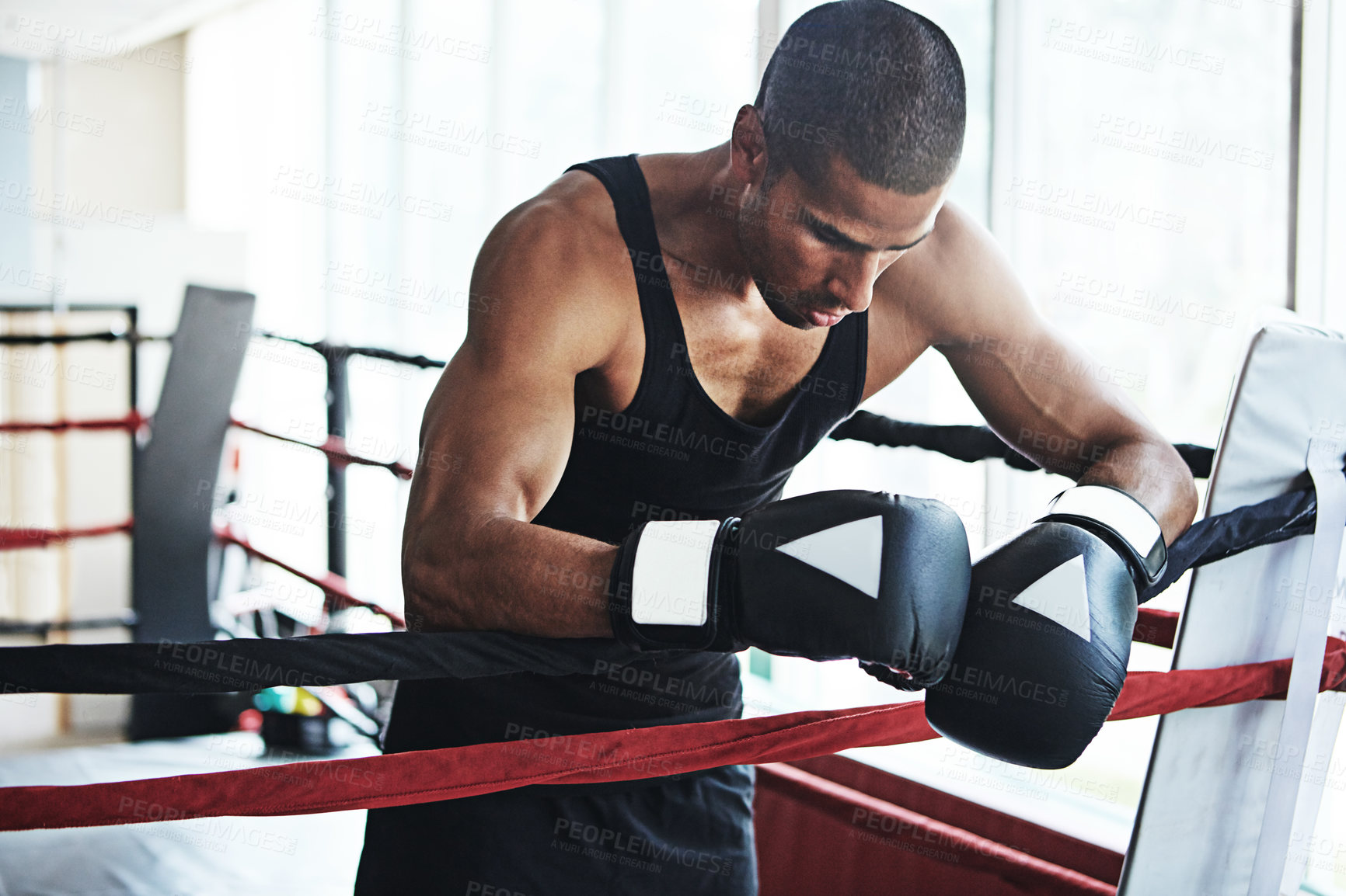 Buy stock photo Tired, boxer and man in ring at gym for challenge, exercise or fail training competition for body health. Stress, fight and sport athlete resting on break with fatigue, defeat or depression