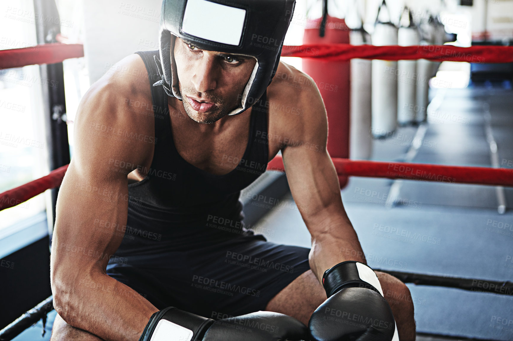 Buy stock photo Thinking, athlete man and boxer in boxing ring at gym for fitness, exercise and fight reflection. Male person, vision and gear in arena for sports contest, match decision and solution for tournament