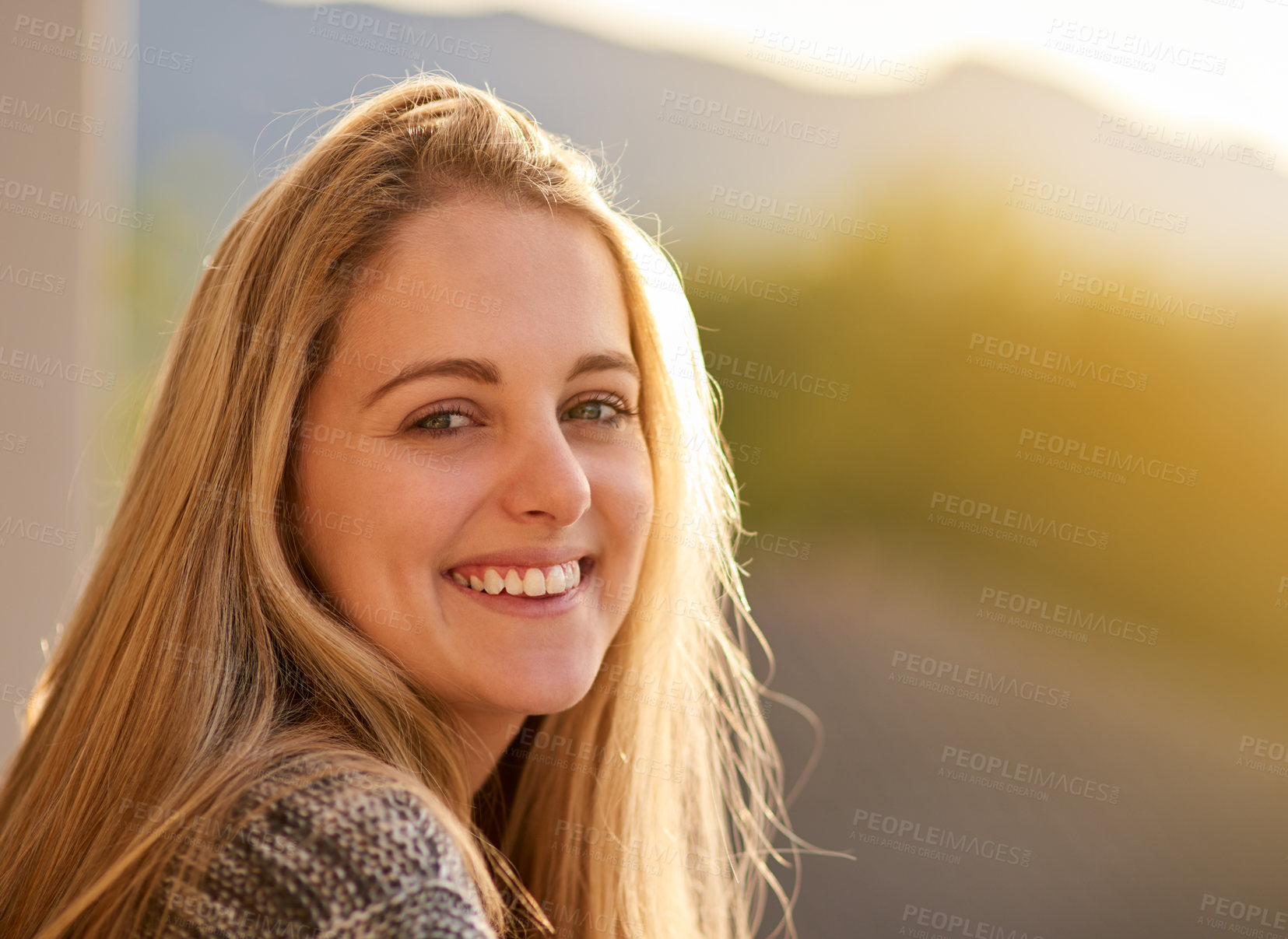 Buy stock photo Portrait of an attractive young woman enjoying a day outdoors