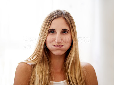 Buy stock photo Portrait of a young woman rinsing her mouth with mouthwash at home
