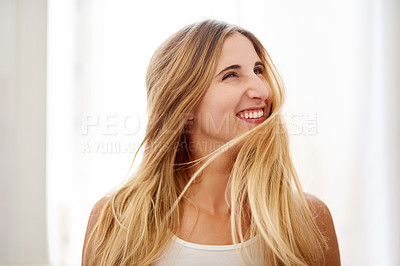 Buy stock photo Shot of a beautiful young woman flipping her hair in the bathroom at home