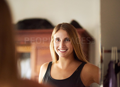 Buy stock photo Portrait of a beautiful young woman getting dressed in her bedroom at home