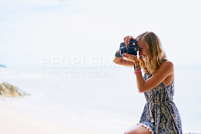 Buy stock photo Shot of a young woman taking pictures while on holiday in Thailand