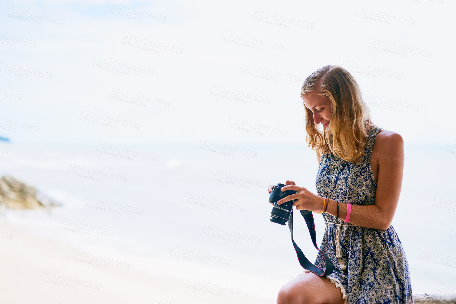 Buy stock photo Shot of a young woman taking pictures while on holiday in Thailand