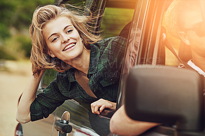 Buy stock photo Cropped shot of a young couple enjoying a roadtrip together