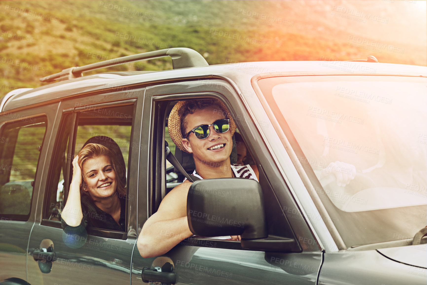 Buy stock photo Portrait of a young couple enjoying a roadtrip together