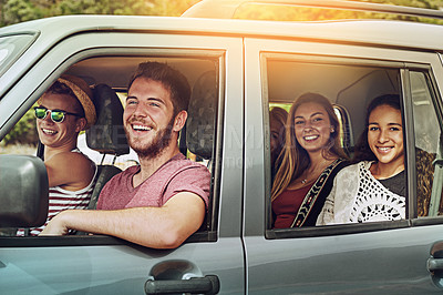 Buy stock photo Cropped shot of a group of friends enjoying a roadtrip together