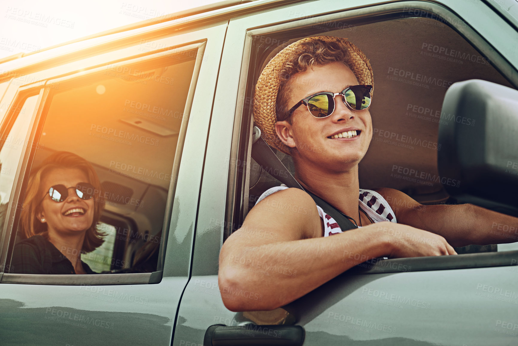 Buy stock photo Cropped shot of two friends enjoying a roadtrip together