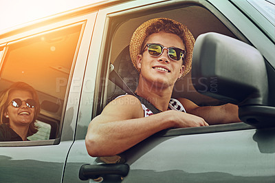 Buy stock photo Cropped shot of a young couple enjoying a roadtrip together
