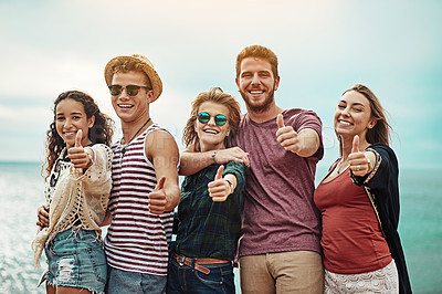Buy stock photo Portrait of a group of friends showing thumbs up outside